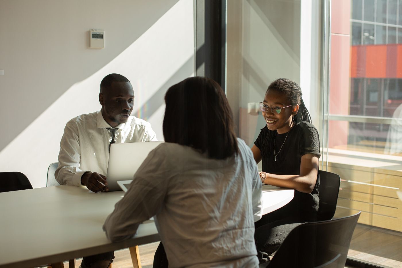 Audico consultants in discussion with a client